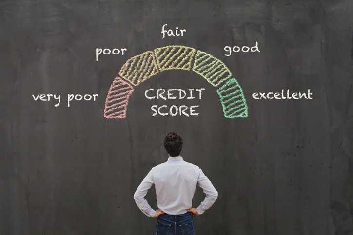 Man staring at credit score after filing for bankruptcy